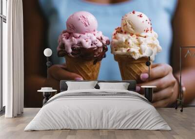 A woman holding two ice cream cones in her hands Wall mural