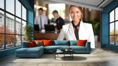 Female hotel manager welcomes quests in lobby of a business hotel. Generative AI. Wall mural