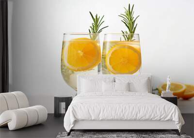 Two glasses of Rosemary Citrus Sprizer with orange slices and a sprig of rosemary. AI generative image. Wall mural