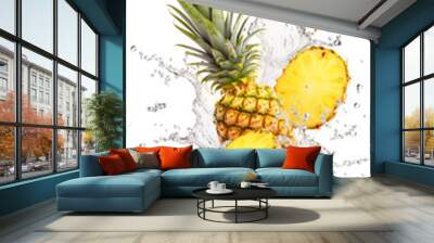 Two pineapples are splashing into the water. Water or juice splash on white background Wall mural