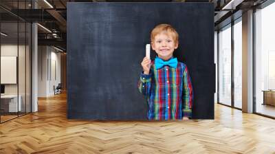 Boy with red hair looking forward far classwork Wall mural