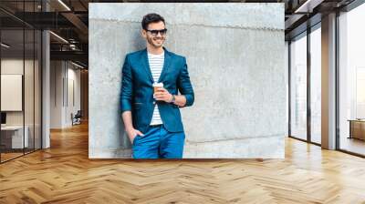 Concept for stylish young man outdoors Wall mural