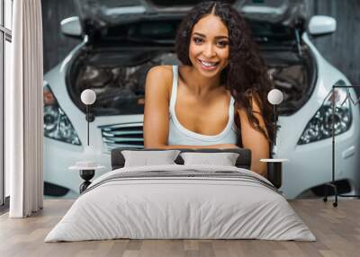 Concept for young sexy female car repair Wall mural