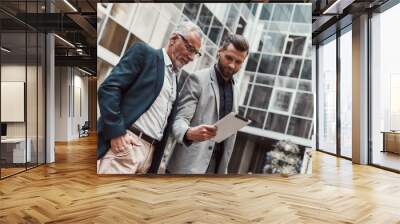 Easy and convenient. Businesspeople discussing new ideas before business lunch Wall mural