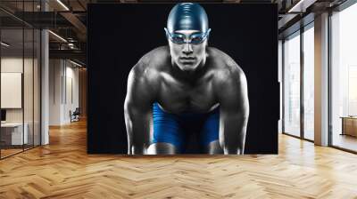 Fitness swimmer on black background Wall mural