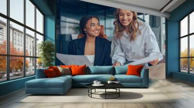 Two professional executives female experts discussing financial accounting papers working together Wall mural