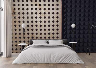 Wooden surface with round holes and black soundproof wall with acoustic dampening foam. Texture, pattern, background. Wall mural