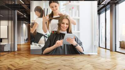 young women sitting in beauty hair salon style Wall mural