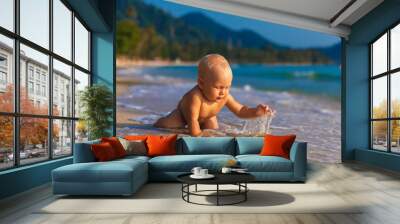 A little kid having fun on a tropical beach. Wall mural