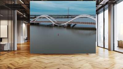 Aerial drone view of modern Enneus Heerma Bridge Amsterdam Netherlands Wall mural