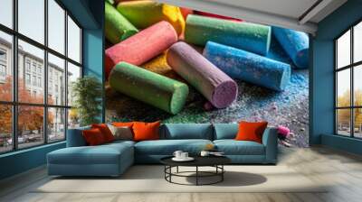 Colorful chalk sticks on a black background, with copy space Wall mural