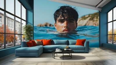 Young Man Swimming in the Ocean. Wall mural