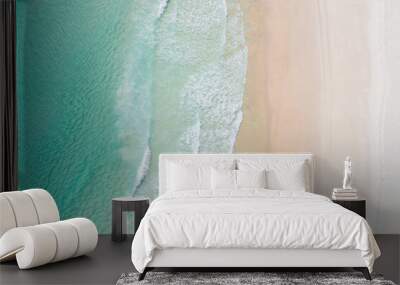 Aerial view of a beach with gentle waves and white sand in a tropical wonderland Wall mural