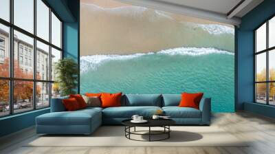 Aerial view of a beach with gentle waves and white sand in a tropical wonderland Wall mural