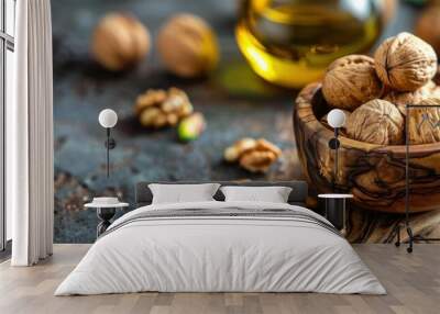 A wooden bowl filled with assorted nuts sits next to a bottle of oil on a table. Wall mural