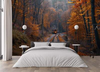 Autumn train through forest Wall mural