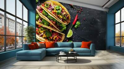 Colorful tacos filled with fresh ingredients on a dark stone surface with garnishes Wall mural