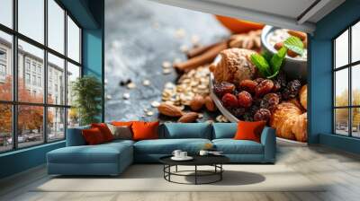 Plate of croissants, nuts, and orange juice for breakfast Wall mural