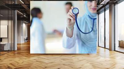 Confident Muslim doctor with hijab or medical student pose at hospital Wall mural