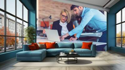 Happy business partners working on laptop. Teamwork, co-working concepts. Wall mural