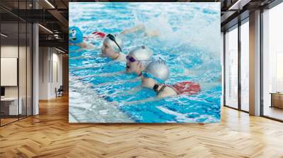 happy children kids group at swimming pool class learning to swim Wall mural