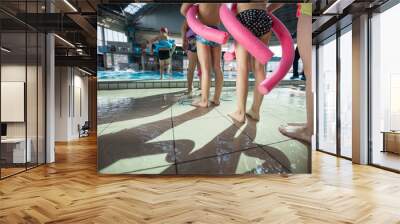 happy children kids group at swimming pool class learning to swim Wall mural