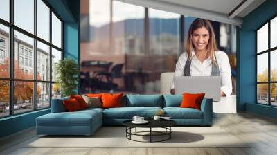 Modern business woman in the office working at computer Wall mural