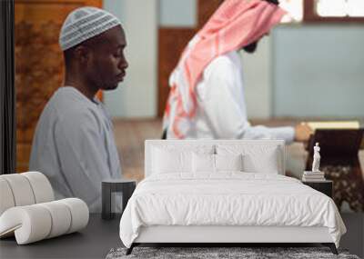 Two Religious muslim man praying inside the mosque Wall mural