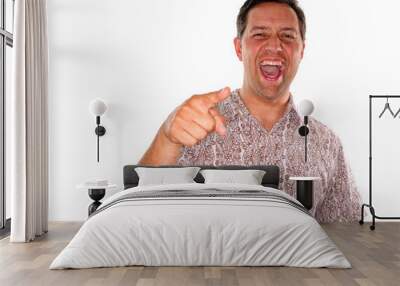 Young man laughing and pointing Wall mural