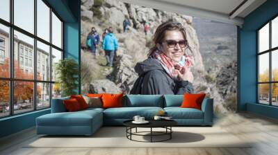 Shallow focus shot of a female with a hiking pole in Riofrio, Avila, Spain Wall mural