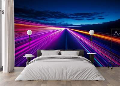 Abstract colorful light streaks on a dark road at night. Wall mural