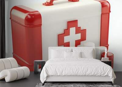 Red first aid kit with white cross and various pills isolated on white background. Wall mural