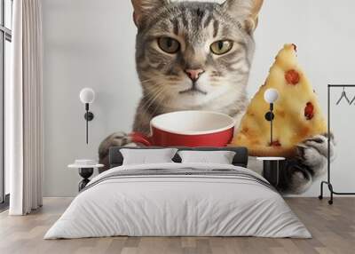 Tabby cat holding a slice of cake and red cup. Wall mural