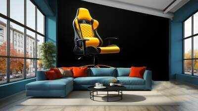 Yellow and black gaming chair isolated on a black background. Wall mural