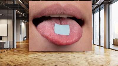 lsd mark on tongue closeup, psychedelic drug trip. Wall mural