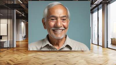 Smiling hispanic senior man in bright colours  Wall mural