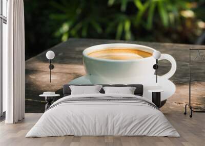 black coffee in white cup on wooden table. Wall mural