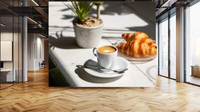 Hot coffee and croissant breakfast in a sunny morning, natural light. Wall mural