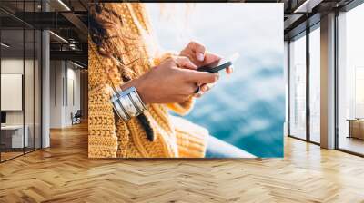 young woman hands using phone Wall mural