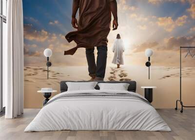 A man walking in the sand following God. Religious theme concept. Wall mural