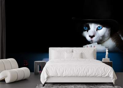 Cat wearing a hat playing poker with four aces in hand Wall mural