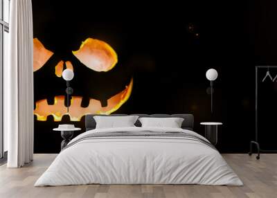 Glowing pumpkin halloween concept in a dark background Wall mural