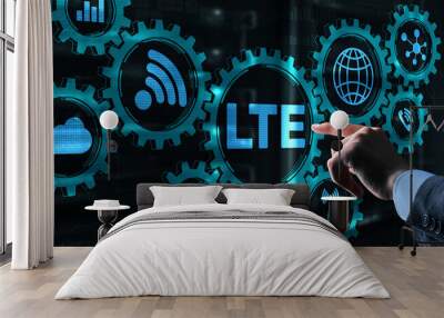 LTE concept on Server Room Background. Young business man presses with a finger LTE. Wall mural