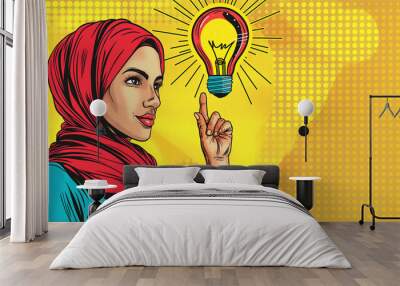 Pop art and business concept. Muslim woman in hijab pointing at light bulb and new idea background retro comic style. Wall mural