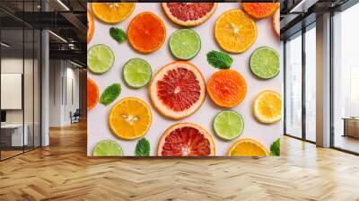 Vibrant and colorful pattern featuring citrus fruit slices and mint leaves on a lively background, suitable for culinary, food, and decorative themes Wall mural