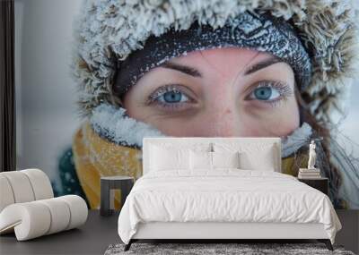 adventurous woman traveler in the arctic with snowcovered eyelashes and clothes travel photography Wall mural