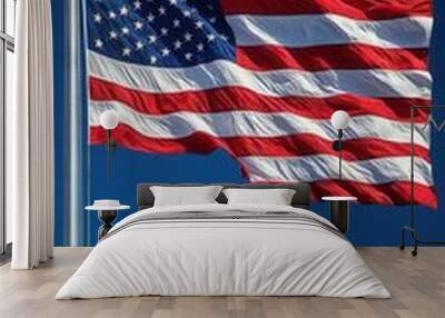 majestic american flag waving proudly against clear blue sky vibrant red white and blue colors dynamic motion captured midflutter patriotic and inspiring imagery Wall mural