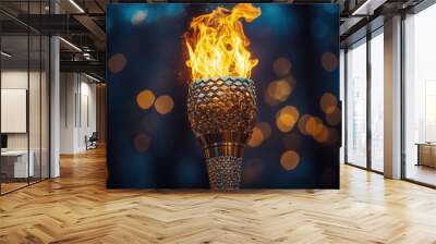 majestic olympic torch with billowing flame against night sky gleaming metal dynamic fire and starry background symbolize athletic spirit and global unity Wall mural