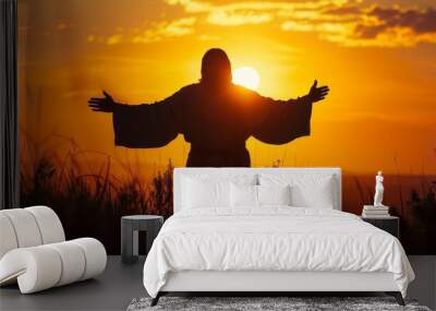 Silhouette of Jesus Christ with open arms, welcoming, with a sunrise background. Wall mural