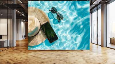 tropical vacation essentials mobile phone sunglasses and hat on blue pool water product mockup Wall mural